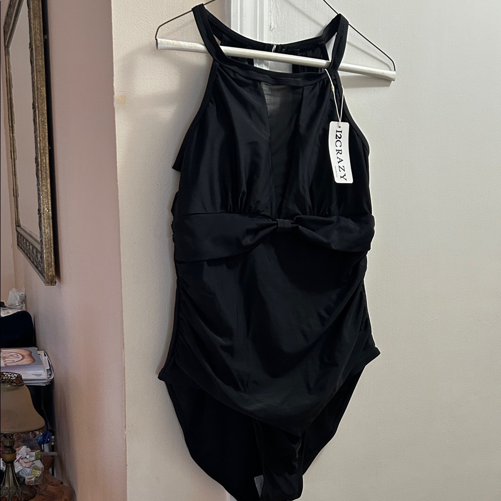 Women’s Black One Piece Swimsuit XL is NWT.